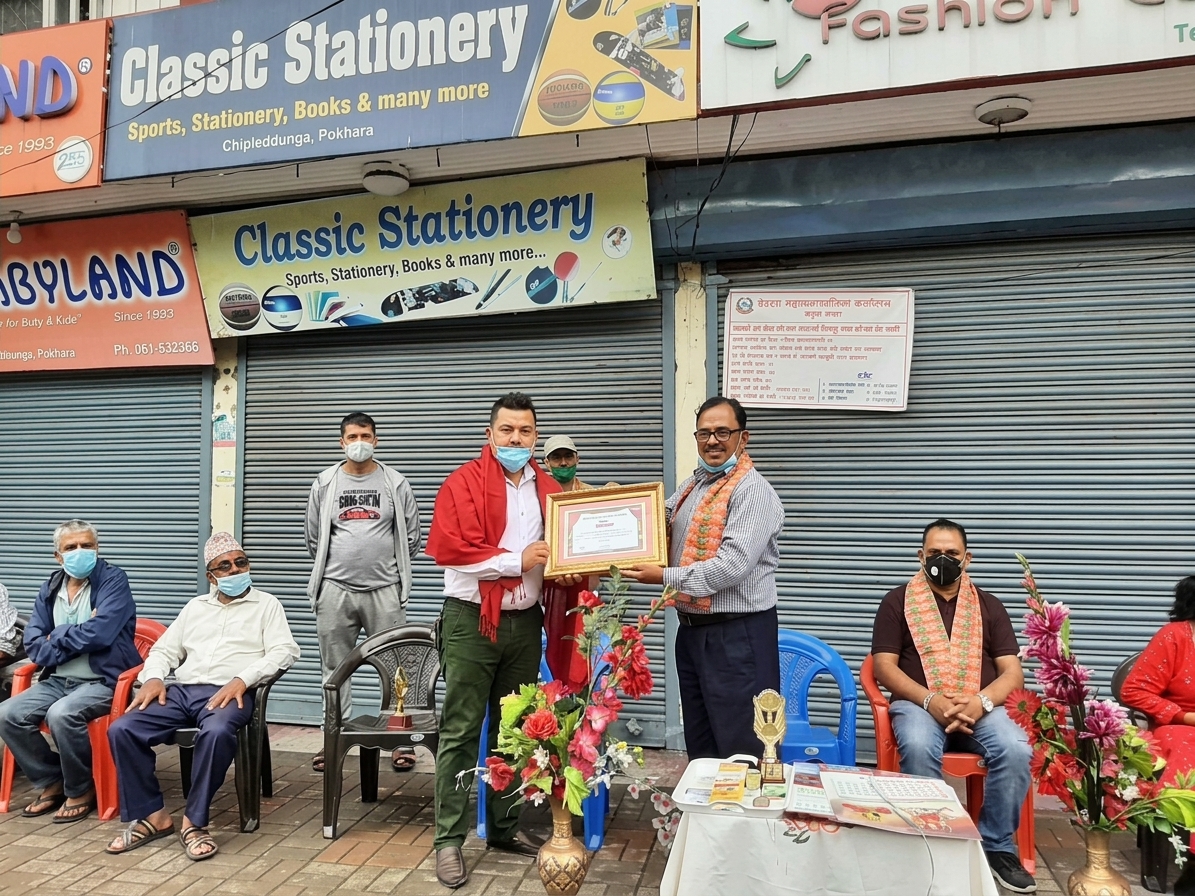 Kamala Construction Pvt. Ltd. representative receiving a certificate