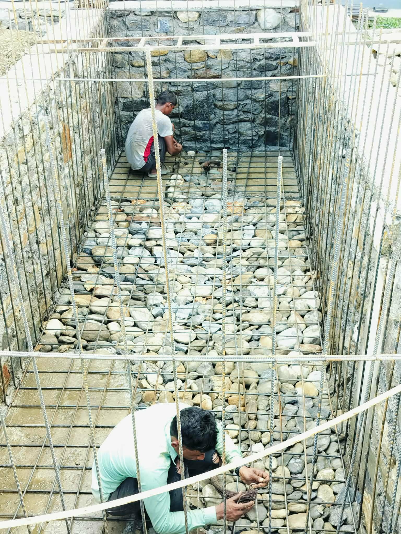 Stone masonry and reinforcement work in progress
