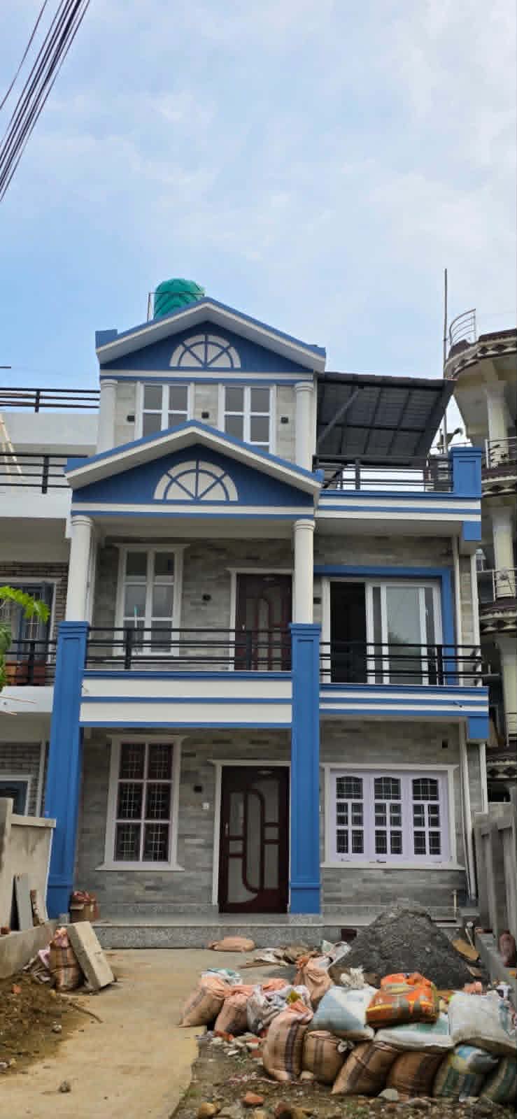 Residential facade with balconies and a covered terrace
