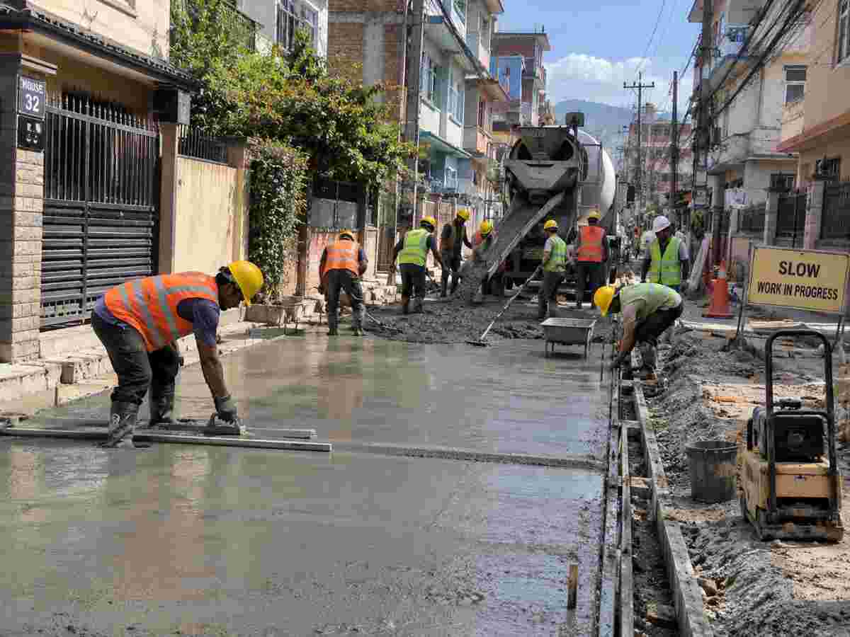 Active road concreting work in an urban Nepal setting